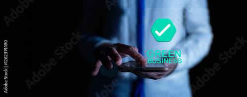 A businessman interacts with a holographic interface displaying a green business certification. The futuristic digital concept highlights sustainability and eco-friendly business practices.