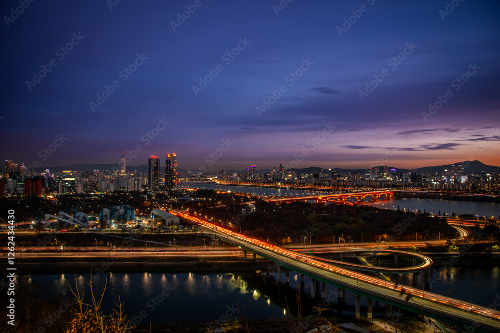 Fototapeta premium Aerial view of Seoul cityscape at dusk hour. Sunset over the Seoul City.