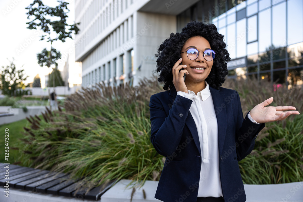 Elegant good-looking business woman talking on the phone Elegant good-looking business woman talking on the phone