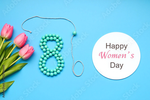 Blue bg white circle with text string of turquoise beads in 8 shape and tulips photo