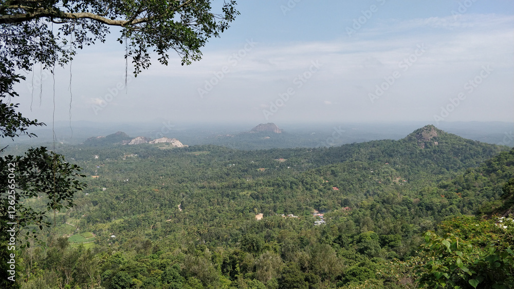 A beautiful mountain range with a clear blue sky. Edakkal Caves, Kerala, India