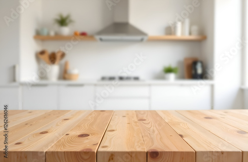 Empty wooden table with the bright white interior of the kitchen as a blurred background behind. Blurred background, selective focus.
