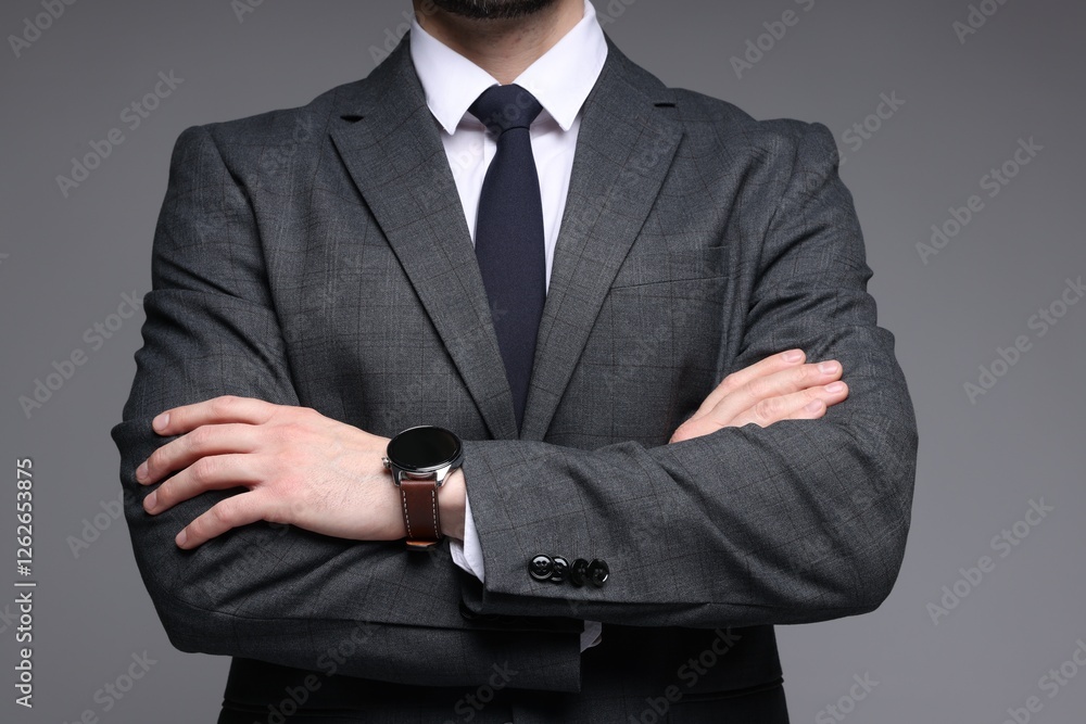 Man in classic suit on grey background, closeup Man in classic suit on grey background, closeup