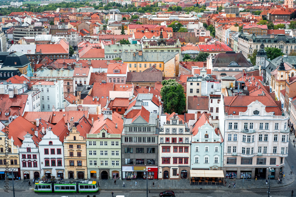 Fototapeta premium Green tram passing through Republic Square in Plzen (Pilsen), Czech Republic