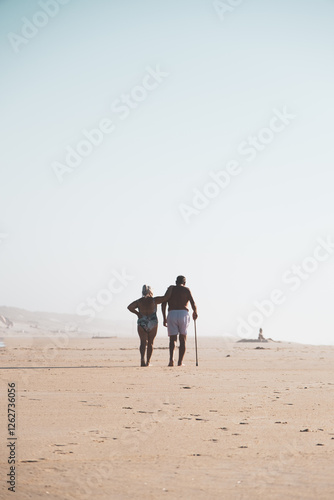 Beautiful couple walking on the beach