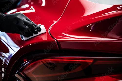 Obraz na płótnie Ceramic or graphene coating on red paint ensures vibrant color deep gloss and extended durability w salonie