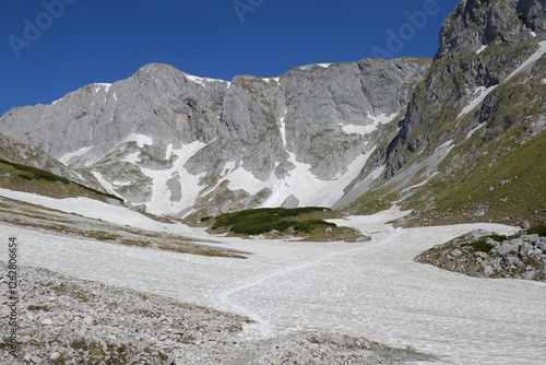 Wonderful Spring landscape after strong winter, panorama of mountain Hochschwab with snow residues. Perfect weather and clear blue sky at a hike on the summit. Styria, Austria