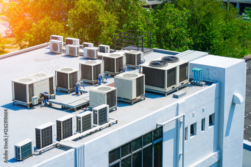 The external block units of the commercial air conditioning and ventilation systems are installed on the roof of an industrial building.