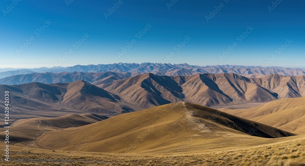 Fototapeta premium Scenic Mountain Range Landscape Under Clear Blue Sky for Travel Inspiration