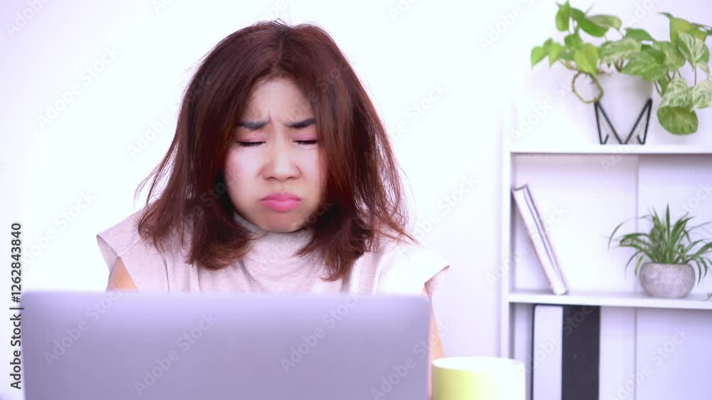busy Asian woman employee feeling tired, exhausted, and fatigued while working on laptop, experiencing depression busy Asian woman employee feeling tired, exhausted, and fatigued while working on laptop, experiencing depression