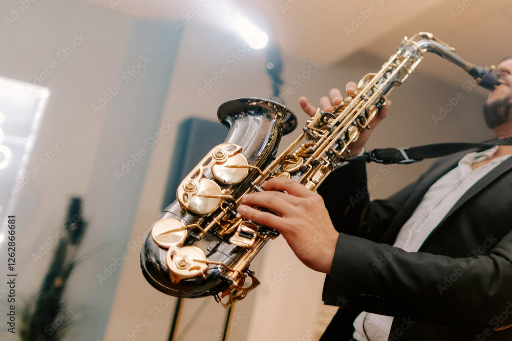 Obraz premium Man plays saxophone, classical jezz music, concert