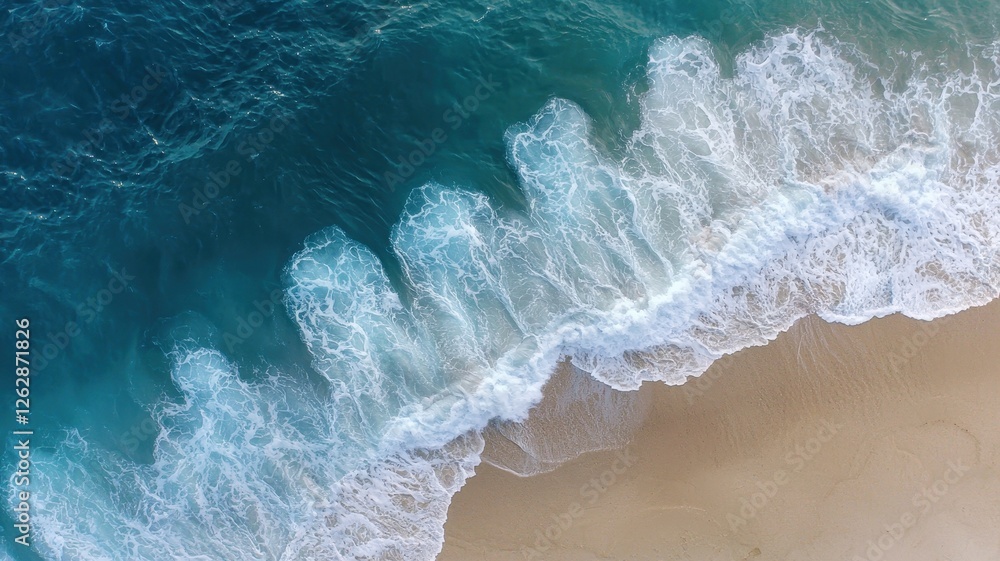 Aerial view of ocean waves gently lapping a sandy beach. Aerial view of ocean waves gently lapping a sandy beach.