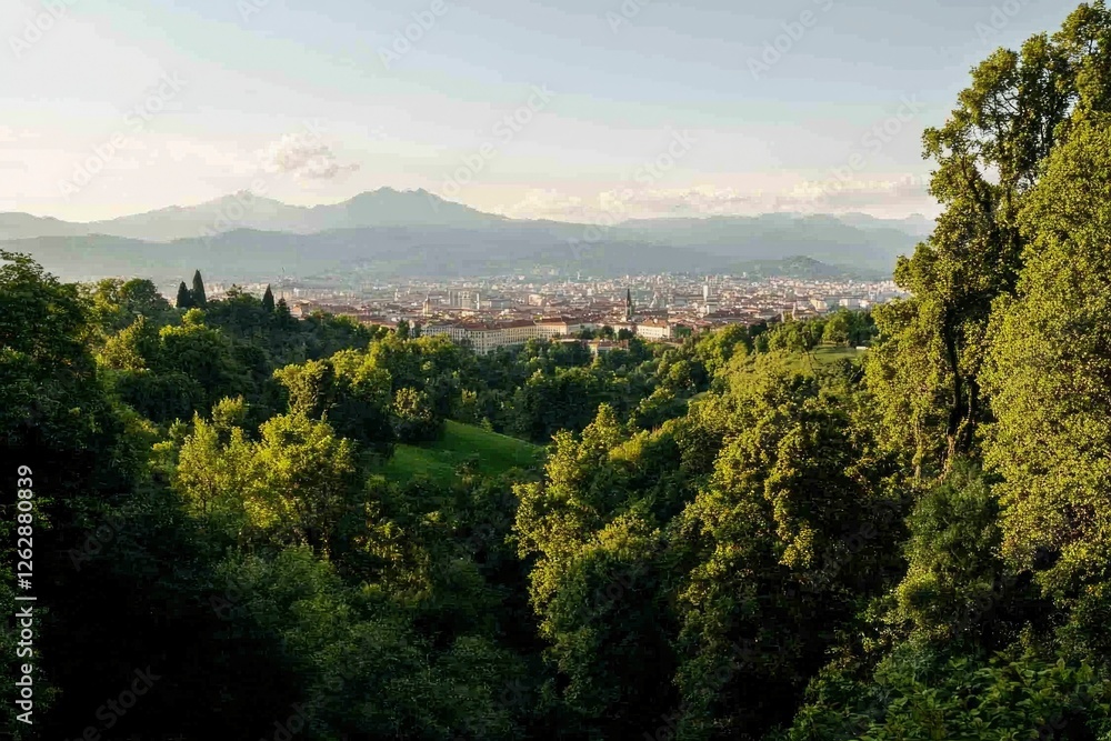 Fototapeta premium Panoramic view of city nestled in valley, mountains in background. Ideal for travel or nature photography