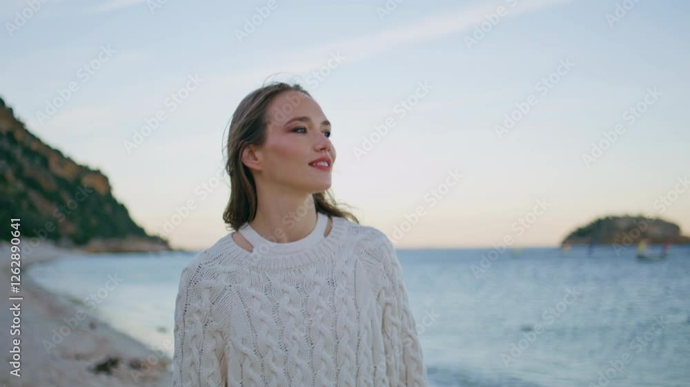 Serene girl walking beach at beautiful evening closeup. Happy woman exploring Serene girl walking beach at beautiful evening closeup. Happy woman exploring
