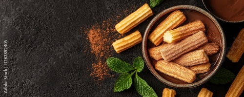 Close up view of freshly fried golden churros pastries dusted with aromatic cinnamon powder displayed on a dark rustic background