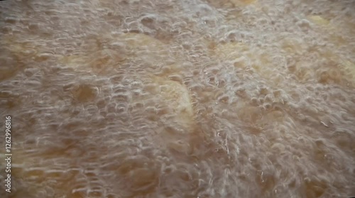 Boiling hot oil is used to fry potatoes