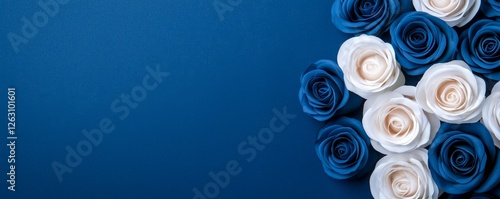 A serene arrangement of blue and white roses against a deep blue background, creating a calming and elegant visual.