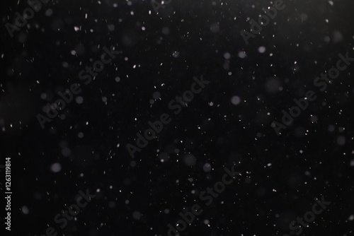 Abstract texture. Falling snow isolated on black background. Layer to overlay and blend snowfall into your photo project.	
