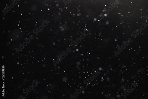 Abstract texture. Falling snow isolated on black background. Layer to overlay and blend snowfall into your photo project.	
