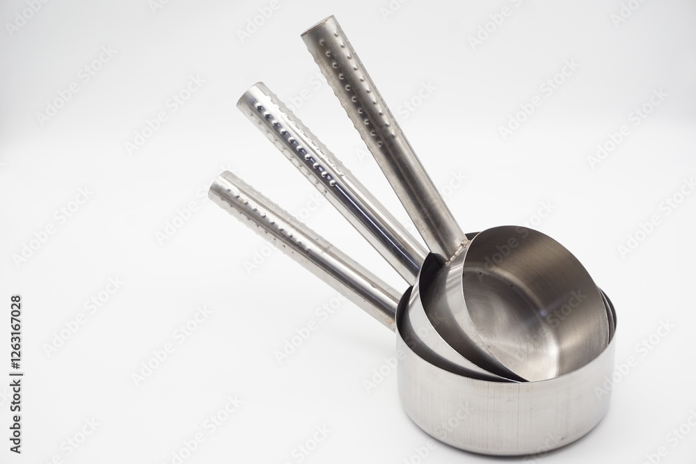 Industrial metal colander, can also be used for household stainless steel water scoop close up on white background Industrial metal colander, can also be used for household stainless steel water scoop close up on white background