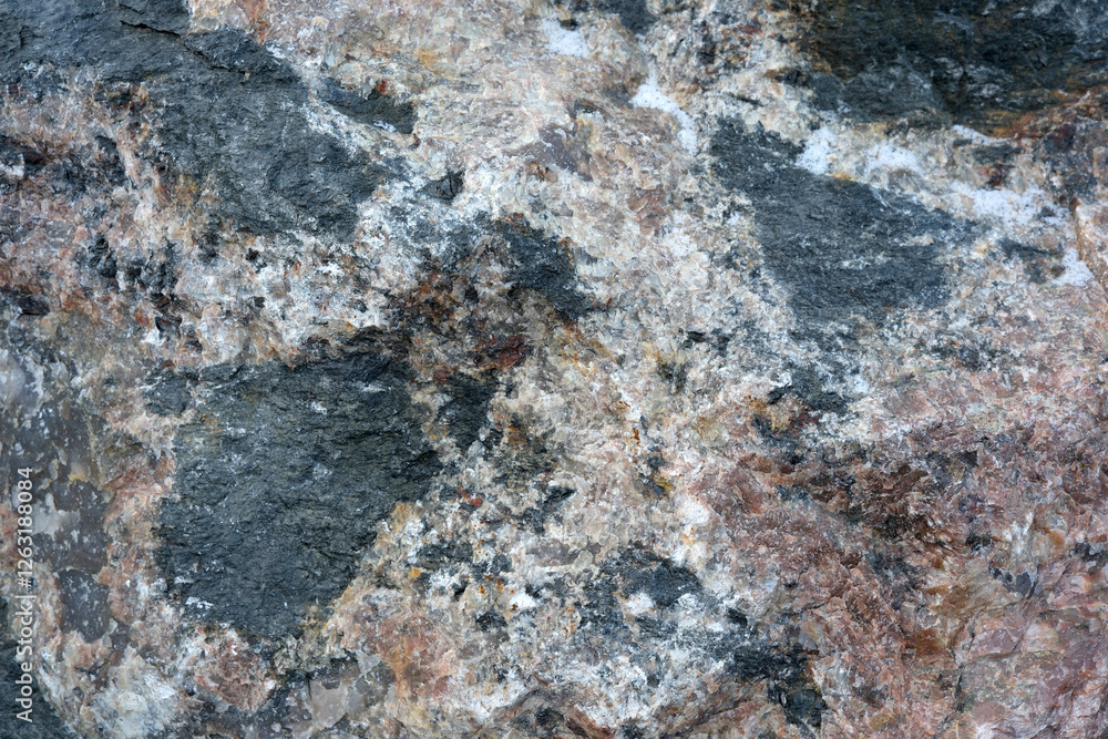 Naklejka premium Exploring the intricate textures of colorful granite rocks