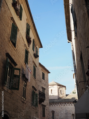 Narrow cozy sunny beige streets of Kotor, Montenegro, Balkans. Historical center of the old town