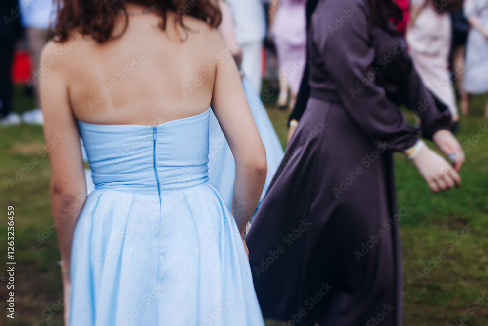 High school graduates dancing on prom, waltz and classical ball slow dance in dresses and suits on school graduation party, boys and girls ballroom dancers, couples dance quadrille and polonaise High school graduates dancing on prom, waltz and classical ball slow dance in dresses and suits on school graduation party, boys and girls ballroom dancers, couples dance quadrille and polonaise