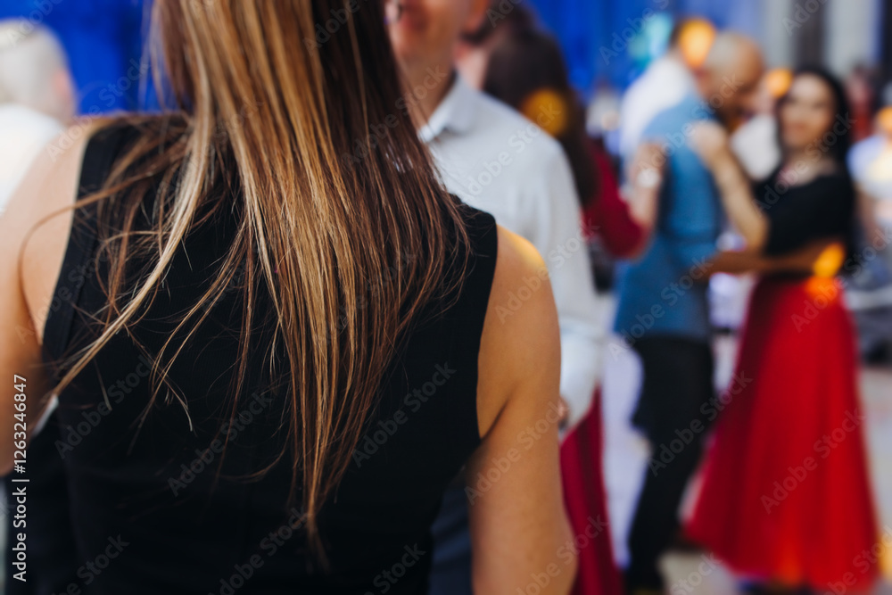 Fototapeta premium High school graduates dancing on prom, waltz and classical ball slow dance in dresses and suits on school graduation party, boys and girls ballroom dancers, couples dance quadrille and polonaise