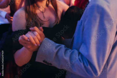 High school graduates dancing on prom, waltz and classical ball slow dance in dresses and suits on school graduation party, boys and girls ballroom dancers, couples dance quadrille and polonaise photo