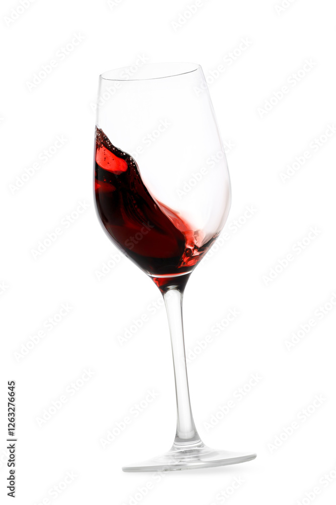 Red wine splashing in glass on white background Red wine splashing in glass on white background