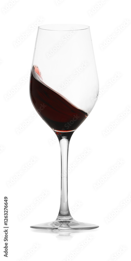 Red wine splashing in glass on white background Red wine splashing in glass on white background