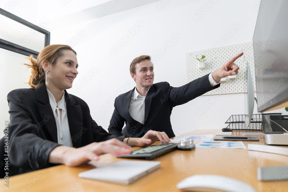 Colleagues collaborating on a project in a modern office Colleagues collaborating on a project in a modern office