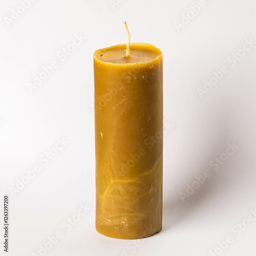 honey yellow candle on white background