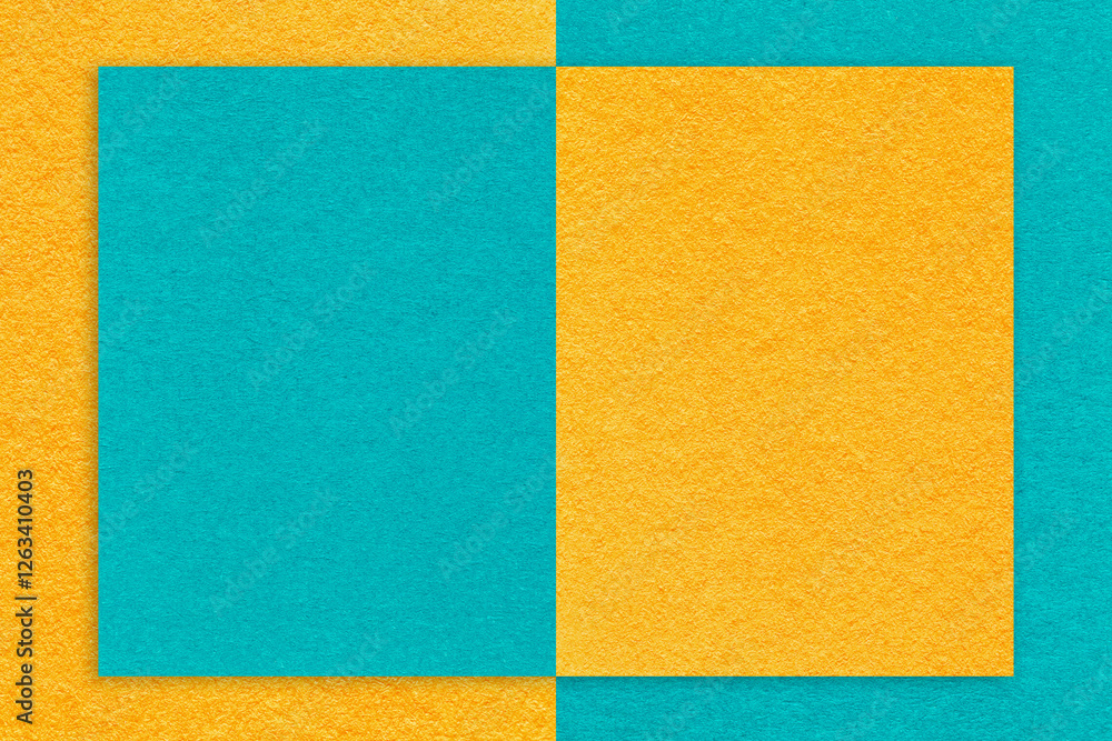 Fototapeta premium Texture yellow and turquoise paper background with geometric shape, macro. Structure craft cerulean cardboard