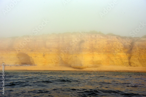 foggy landscape, the Algarve rock formation  is a unique and amazing natural wonder located in the coastal town of Porches, Portuga