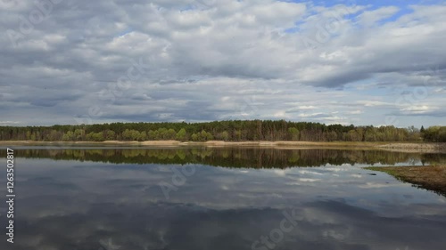 Nature scenery. Autumn forest lake. Autumn in forest lake. Colorful trees reflecting in calm water surface. Autumn park with lake. Seasonal specific. Autumnal landscape with wood river