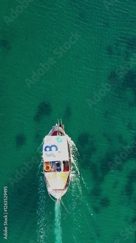 Aerial view of a fishing boat sailing in Nea Potidea canal. Greece, Kassandra, Halkidiki photo