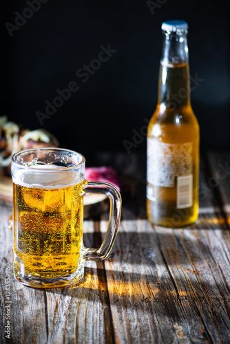 Golden lager in a mug, illuminated by sunlight.