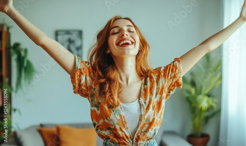 Young woman enjoying a lively day indoors, expressing joy and happiness in a comfortable living environment, while embracing a trendy style