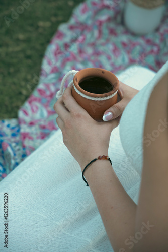 holding the cocoa concoction photo