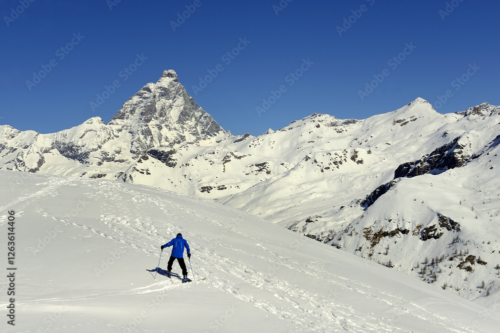 Snowy terrains below the Matterhorn peak - Monte Cervino, Italy. The mountain lies on the border between Switzerland and Italy, above the Swiss town of Zermatt and the Italian town of Breuil-Cervinia