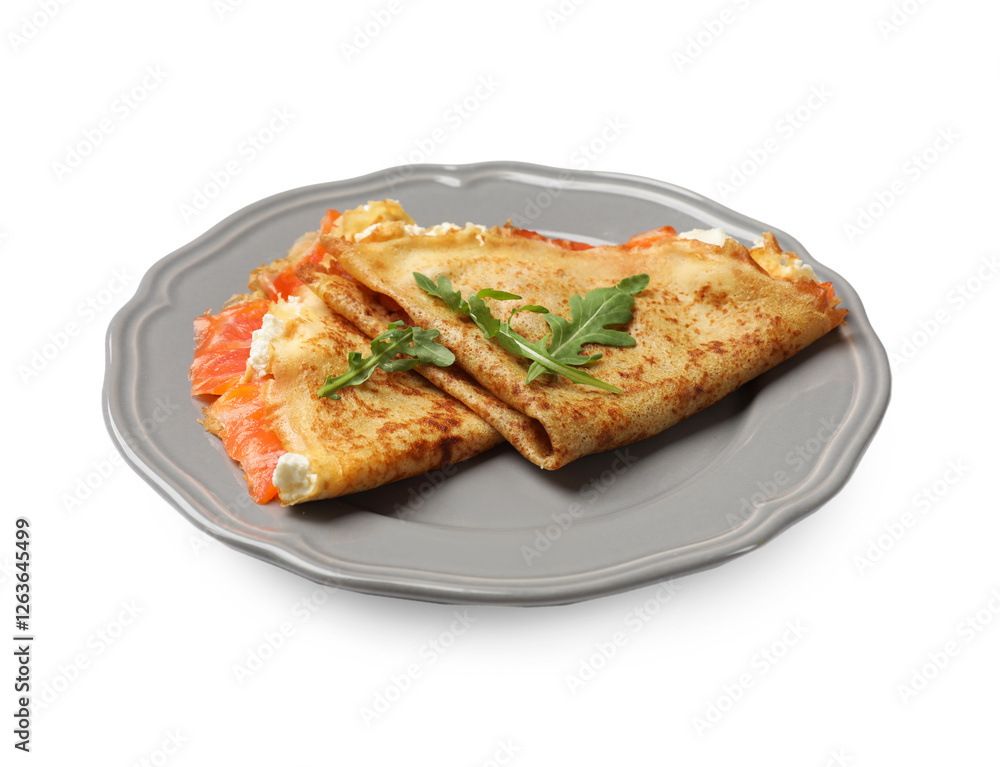 Delicious crepes with salmon, cream cheese and arugula isolated on white