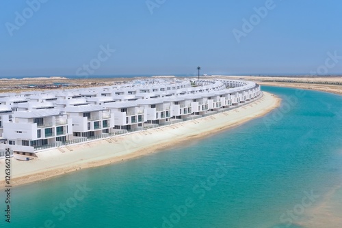 Photography Panoramic view on new waterfront villas neighborhood with direct access to beach on completion stage