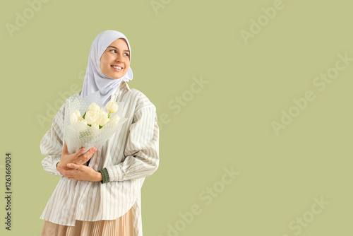 Young Muslim woman with tul...