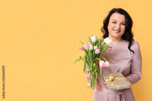 Mature woman with bouquet o...