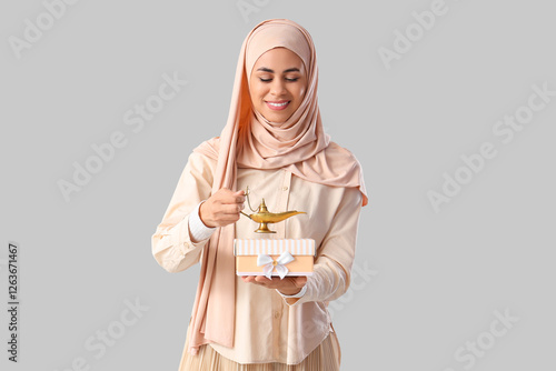 Muslim woman with gift box ...