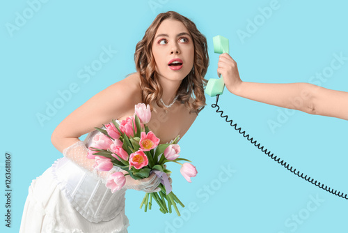 Young woman holding bouquet...