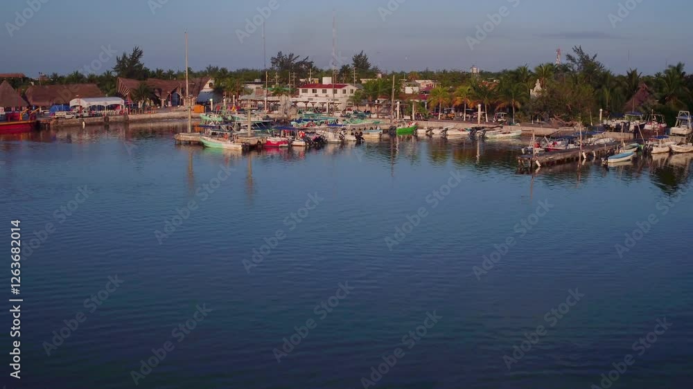 Aerial push in from ocean to tropical village - drone Aerial push in from ocean to tropical village - drone