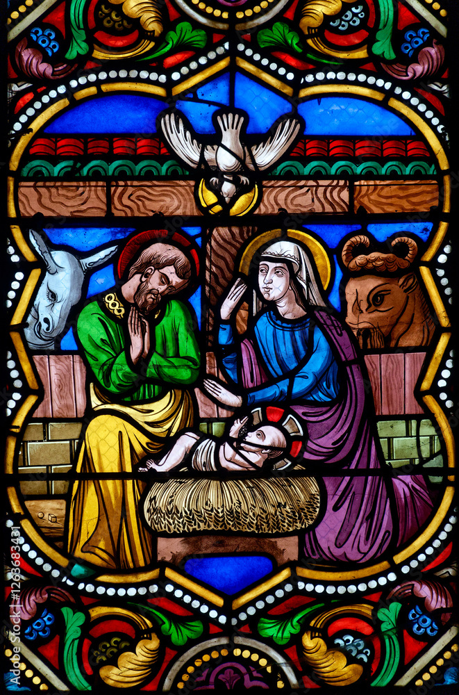 Fototapeta premium Stained glass (19th century) of Christmas Nativity Scene with Virgin Mary, Saint Joseph, and Jesus baby. .