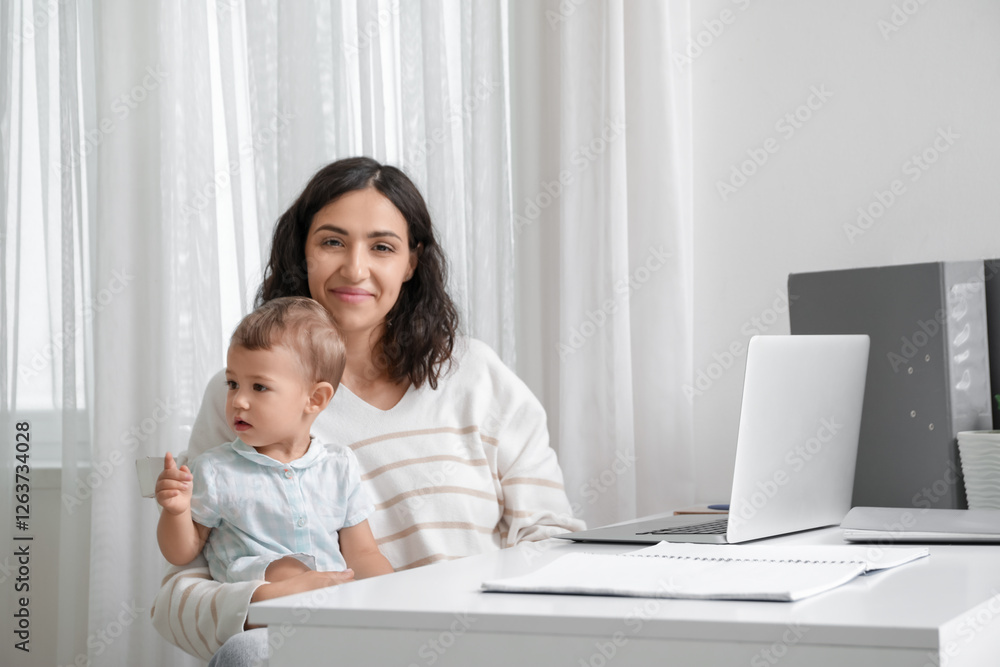 Working mother with her little baby at home Working mother with her little baby at home